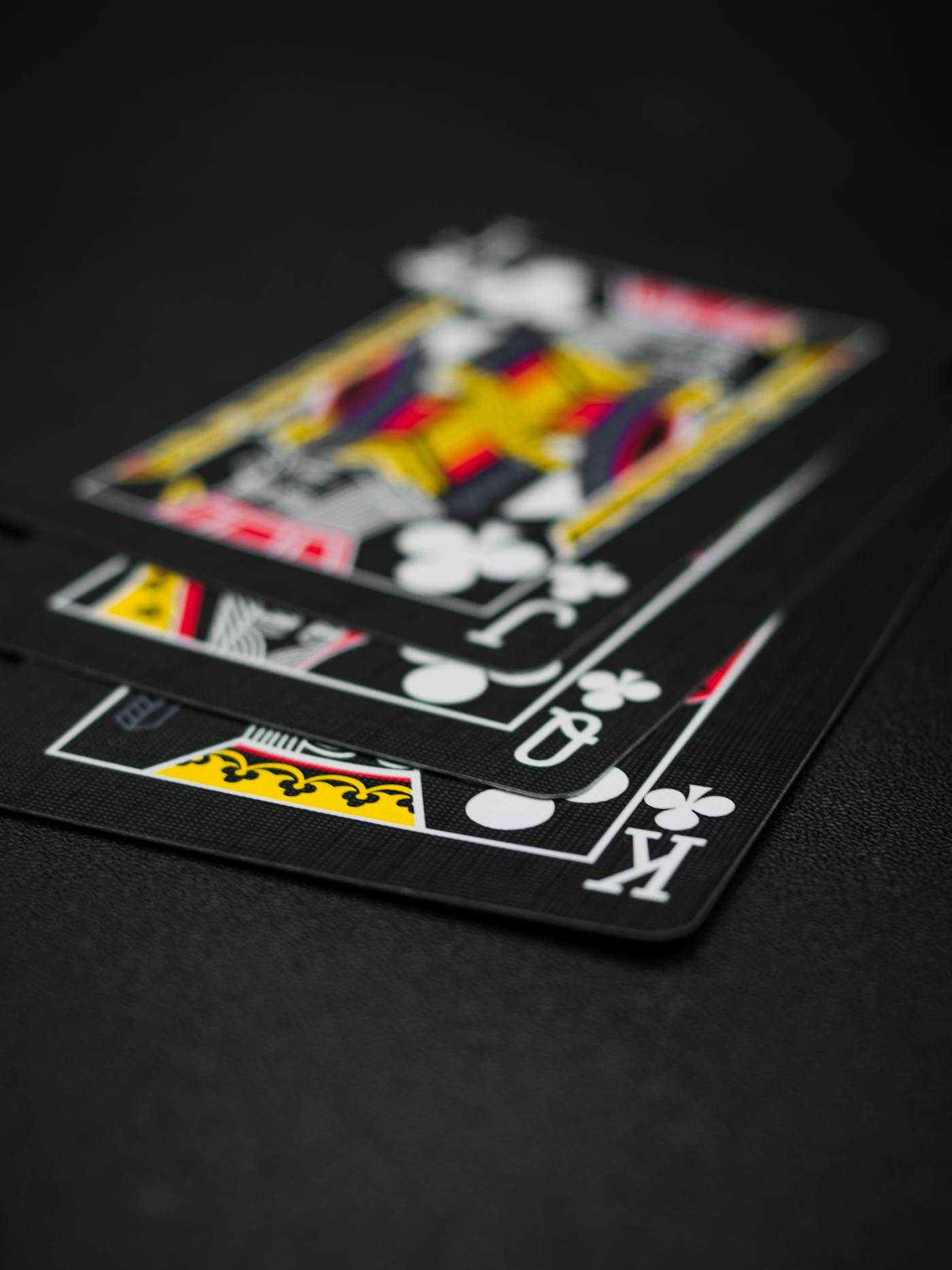 Black playing cards on a black background